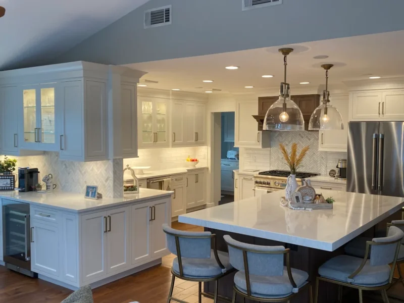 Kitchen remodel · framed inset cabinets · white perimeter&nbsp;· walnut island and range hood